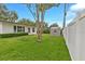 Exterior showing the backyard, shed, and home with nice landscaping at 1666 Souvenir Dr, Clearwater, FL 33755