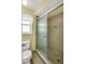 Bathroom featuring a toilet and glass shower door at 1666 Souvenir Dr, Clearwater, FL 33755