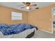Bedroom featuring a ceiling fan and natural lighting at 1666 Souvenir Dr, Clearwater, FL 33755