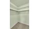 Walk in closet featuring shelving for optimal storage at 1666 Souvenir Dr, Clearwater, FL 33755