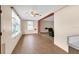 Inviting living room with tile floors, large windows, and a ceiling fan at 1666 Souvenir Dr, Clearwater, FL 33755