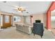 Inviting living room features neutral paint, comfortable seating, and a front door with decorative glass at 1666 Souvenir Dr, Clearwater, FL 33755