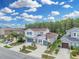 Beautiful two-story home with blue shutters, a well-manicured lawn, and lush landscaping on a sunny day at 1696 Hidden Springs Dr, Trinity, FL 34655