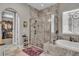 Bathroom boasting walk-in shower, soaking tub and entry to walk-in closet at 1696 Hidden Springs Dr, Trinity, FL 34655