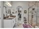 Spacious bathroom with walk-in shower, vanity and walk-in closet access at 1696 Hidden Springs Dr, Trinity, FL 34655