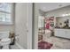 Bathroom featuring toilet, walk-in shower and soaking tub at 1696 Hidden Springs Dr, Trinity, FL 34655