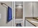 Bathroom with a shower-tub combo and white cabinets with neutral countertops at 1696 Hidden Springs Dr, Trinity, FL 34655