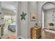 Bedroom hallway with bedroom visible on the left and arched entryway on the right at 1696 Hidden Springs Dr, Trinity, FL 34655