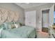 Bedroom featuring queen bed, double closets and doorway at 1696 Hidden Springs Dr, Trinity, FL 34655
