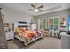 Bright bedroom featuring a cozy bed, natural light, and a calming, neutral color palette at 1696 Hidden Springs Dr, Trinity, FL 34655