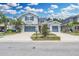 Exterior front of home shows well-manicured landscaping, a driveway and a charming facade at 1696 Hidden Springs Dr, Trinity, FL 34655