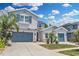 Beautiful home with a well-maintained lawn, mature trees, and a spacious driveway at 1696 Hidden Springs Dr, Trinity, FL 34655