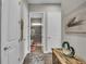 Inviting hallway with neutral colors and decor, leading to a bathroom with tiled shower at 1696 Hidden Springs Dr, Trinity, FL 34655