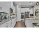 The kitchen has stainless appliances, granite countertops, and tile backsplash at 1696 Hidden Springs Dr, Trinity, FL 34655