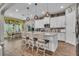 This is an eat-in kitchen with island, chairs, and stainless appliances at 1696 Hidden Springs Dr, Trinity, FL 34655