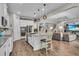 A gourmet eat-in kitchen has stainless appliances and wood-look tile flooring at 1696 Hidden Springs Dr, Trinity, FL 34655