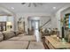 The living room has two seating areas, tile flooring, and an open concept feel at 1696 Hidden Springs Dr, Trinity, FL 34655