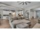View of kitchen from living room with a large sectional gray sofa at 1696 Hidden Springs Dr, Trinity, FL 34655