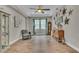Elegant living room with ample natural light, a decorative accent wall, and hardwood floors at 1696 Hidden Springs Dr, Trinity, FL 34655