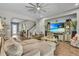 This is an open concept living room with a large sectional sofa and television at 1696 Hidden Springs Dr, Trinity, FL 34655