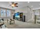 Bright living room features a media center, neutral paint, and a window view of the outside at 1696 Hidden Springs Dr, Trinity, FL 34655