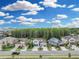 Desirable neighborhood street view featuring manicured lawns and beautiful home exteriors, backing up to mature trees at 1696 Hidden Springs Dr, Trinity, FL 34655