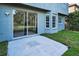 The backyard has a concrete patio and multiple windows allowing for plenty of natural light at 1712 Crossvine Ct, Trinity, FL 34655