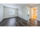 Spacious bedroom with gray walls and hardwood floors at 1712 Crossvine Ct, Trinity, FL 34655
