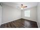 A bedroom with hardwood floors and a window that lets in natural light at 1712 Crossvine Ct, Trinity, FL 34655