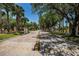 Street view of community entrance with visitor parking at 1712 Crossvine Ct, Trinity, FL 34655