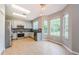 Spacious kitchen with stainless steel appliances, granite counters, and a breakfast nook at 1712 Crossvine Ct, Trinity, FL 34655