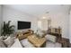 Staged living room with neutral tones, featuring contemporary furniture, providing an inviting and comfortable atmosphere at 1712 Crossvine Ct, Trinity, FL 34655