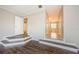 A hardwood floor living room that leads into the hallway, bathroom, and other rooms at 1712 Crossvine Ct, Trinity, FL 34655
