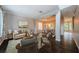 Open-concept living and dining area featuring modern decor, stylish furniture, and plenty of natural light at 1712 Crossvine Ct, Trinity, FL 34655