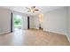 This spacious living room features tile floors and sliding door access to the backyard at 1712 Crossvine Ct, Trinity, FL 34655