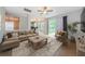 Inviting living room boasts a large window, neutral tones, and an open floor plan, perfect for relaxing at 1712 Crossvine Ct, Trinity, FL 34655