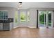 Open floor plan kitchen area with stainless steel dishwasher and lots of light and backyard views at 1712 Crossvine Ct, Trinity, FL 34655