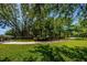 Picturesque park with a walking path, mature trees, and picnic areas for outdoor recreation and relaxation at 1712 Crossvine Ct, Trinity, FL 34655