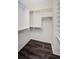 Walk-in closet features custom shelving and storage solutions at 1712 Crossvine Ct, Trinity, FL 34655