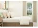 Inviting bedroom with decorative lamps and elegant, minimalist decor at 17518 Happytrails St, Land O Lakes, FL 34638