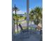 Balcony view featuring outdoor seating with tropical landscaping, a walking path and bay views at 17960 Gulf Blvd # 101, Redington Shores, FL 33708
