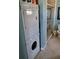 Bathroom with stacked washer/dryer unit and glass shower at 17960 Gulf Blvd # 101, Redington Shores, FL 33708