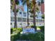 Well-maintained condos in Sunset Reef with lush landscaping and a community sign at 17960 Gulf Blvd # 101, Redington Shores, FL 33708