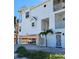 Beautiful exterior with a covered parking area and a view of the unit's entrance and manicured landscaping at 17960 Gulf Blvd # 101, Redington Shores, FL 33708
