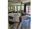 Inviting living room with neutral paint, tile flooring and a sliding glass door at 17960 Gulf Blvd # 101, Redington Shores, FL 33708
