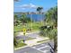 A view of the surrounding neighborhood, showcasing tropical landscaping and bay views at 17960 Gulf Blvd # 101, Redington Shores, FL 33708