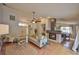 Open-concept living area featuring hardwood floors, fireplace, and view of the dining area at 1955 Cobblestone Way, Clearwater, FL 33760