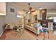 Cozy living room featuring a fireplace, hardwood floors, and ample natural light at 1955 Cobblestone Way, Clearwater, FL 33760
