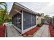 Enclosed patio with access to the pool deck at 1955 Cobblestone Way, Clearwater, FL 33760