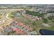 An aerial view of a beautiful community with lush green spaces, ponds, and well-maintained homes at 1972 Wolf Laurel Dr, Sun City Center, FL 33573